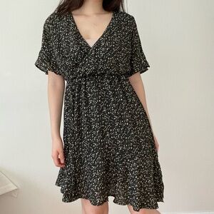 Green and white patterned wrap dress